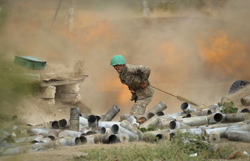 An Armenian serviceman fires a cannon towards Azerbaijan positions in the self-proclaimed Republic of Nagorno-Karabakh, Azerbaijan, Tuesday, September 29, 2020.  (Photo by Sipan Gyulumyan/Armenian Defense Ministry Press Service/PAN Photo via AP Photo)
